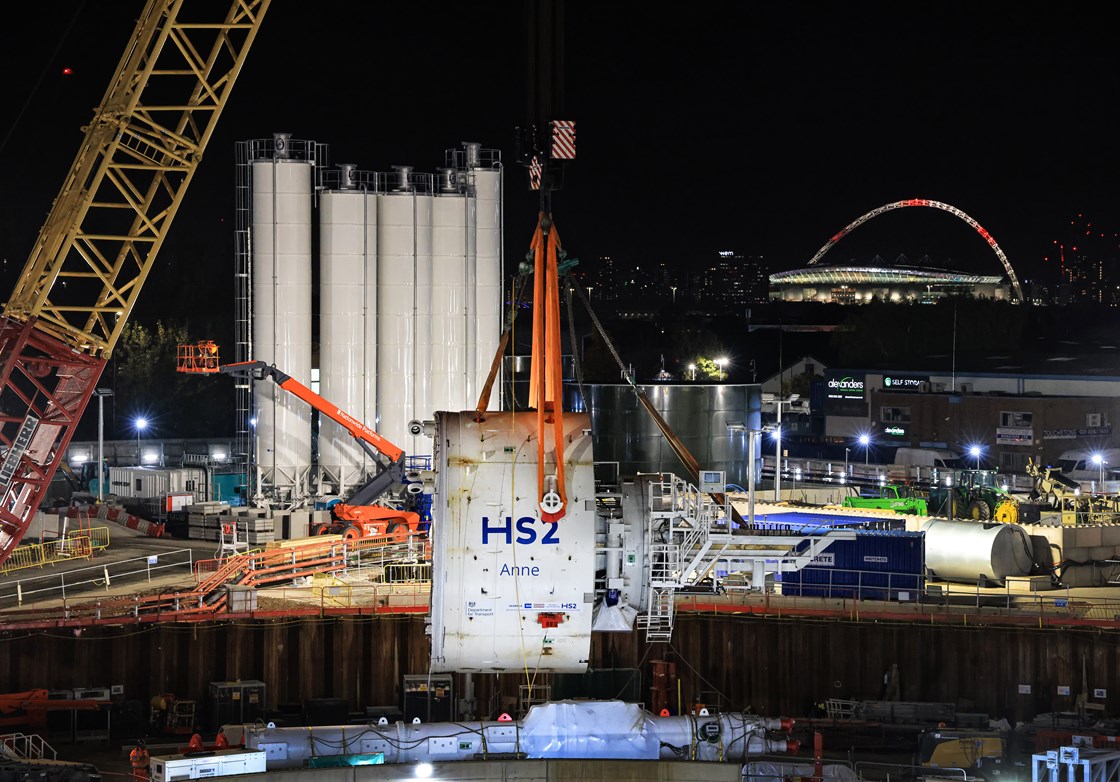 TBM Anne middle shield lowered into the Victoria Road Crossover box with illuminated Wembley arch in background