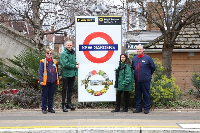 TfL Image - Kew Gardens station staff and Kew Visitor Hosts with the specially designed roundel to mark this partnership