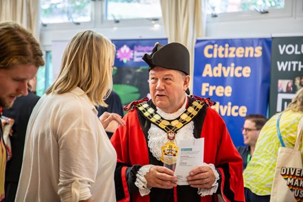 The Mayor of Islington speaks to a member of the public at a previous volunteering fair