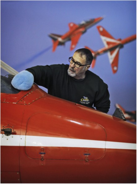 Principal Conservator, Stuart McDonald cleans a Red Arrows Hawk at the National Museum of Flight. Image (c) Paul Dodd (7)