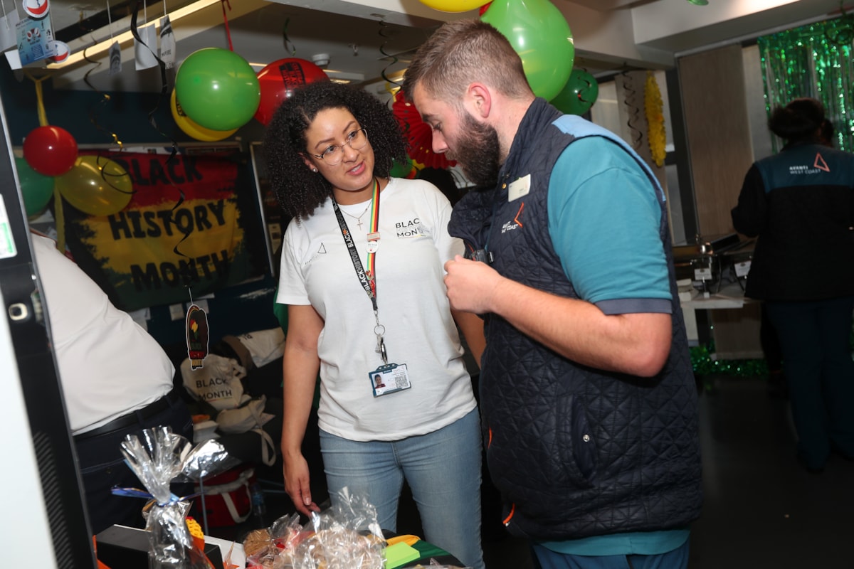 Camille Parchment, Customer Service Assistant at Birmingham New Street, and Dan Millard, Welcome Host at Birmingham New Street, discussing the raffle prizes.