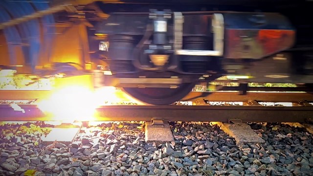 Space-age laser and plasma train trials zap autumn leaves off the line: Close up shot of plasma jet cleaning rail head during Network Rail trials October 2022