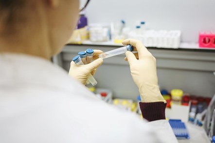 woman with test tubes in lab