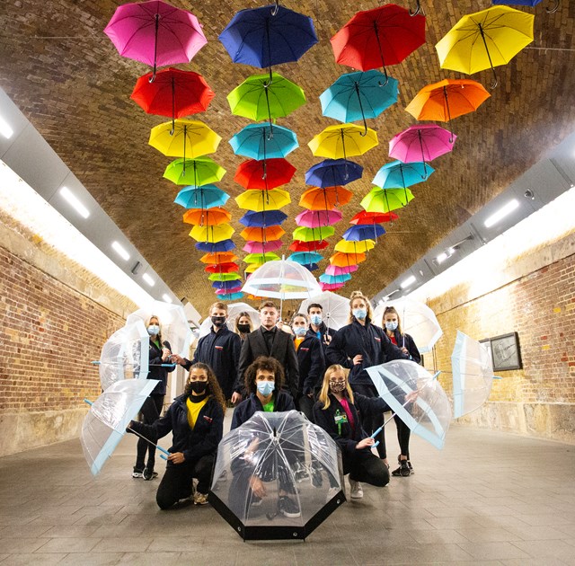 Flash mob London Bridge: Dance group Allure and rapper J Grange pose with umbrellas to celebrate neurodiversity and International Day of Persons with Disabilities