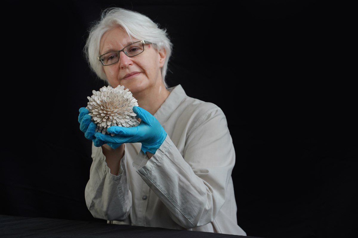 Friederike Voigt, Principal Curator National Museums Scotland, with Junko Mori's New Pinecone Silver Organism, 2007. Photo © Stewart Attwood.