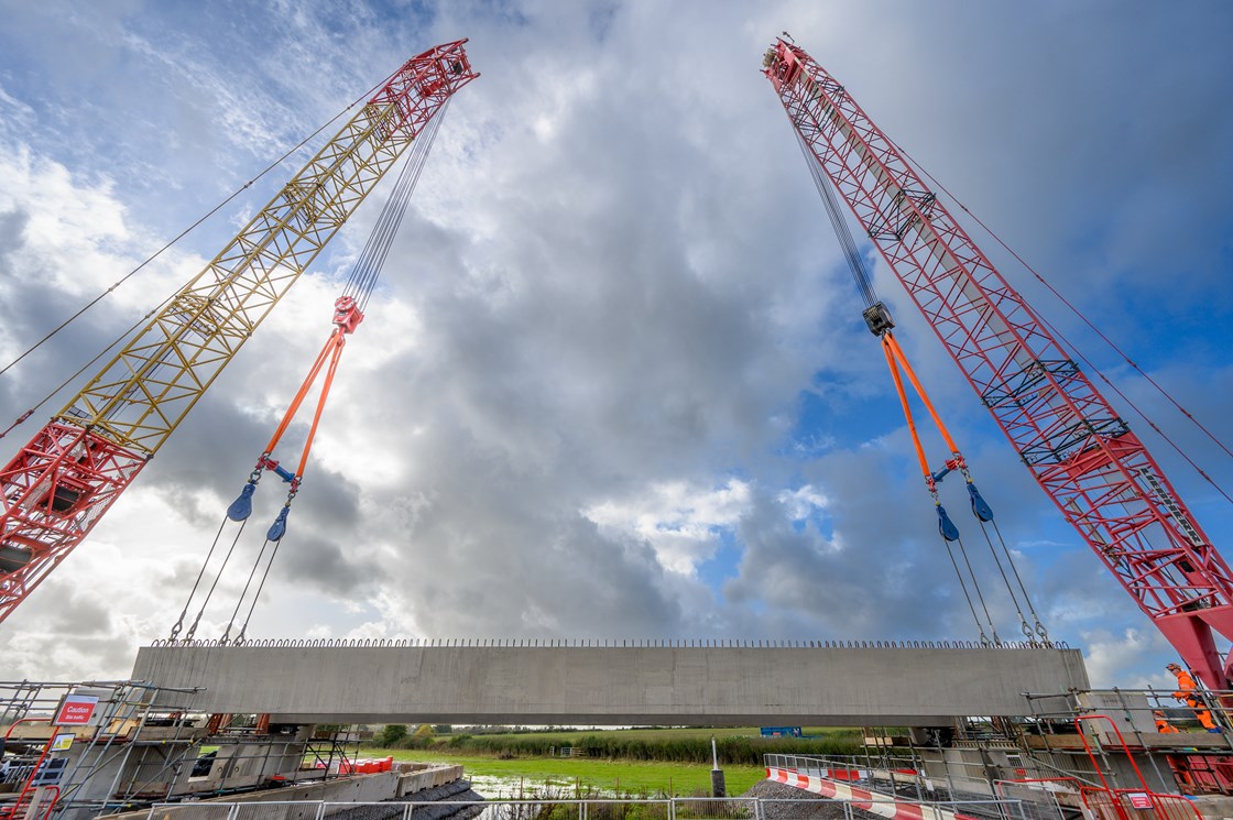 Thame Valey viaduct beam suspended from two crane during construction Oct 2023