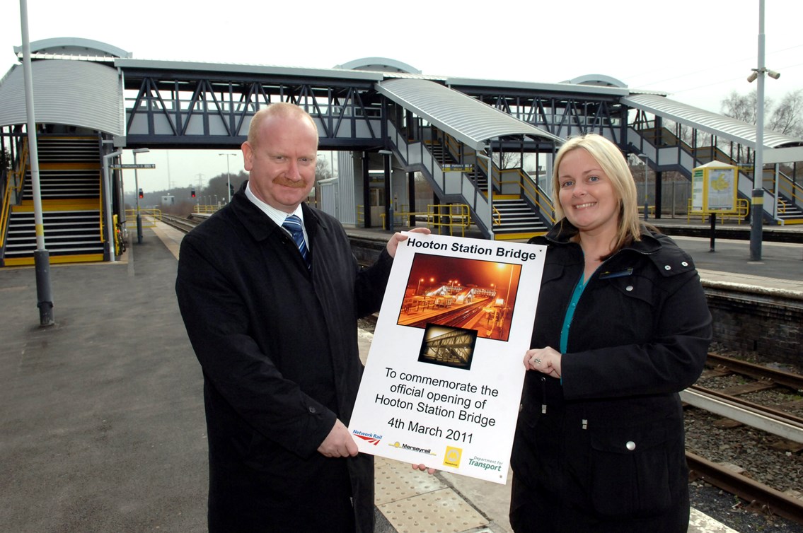 Hooton Access for All: Wayne Menzies, Network Rail area manager Merseyside and Tracey Upton, Merseyrail area customer experience manager, with the plaque to commemorate the opening of the new footbridge and lifts