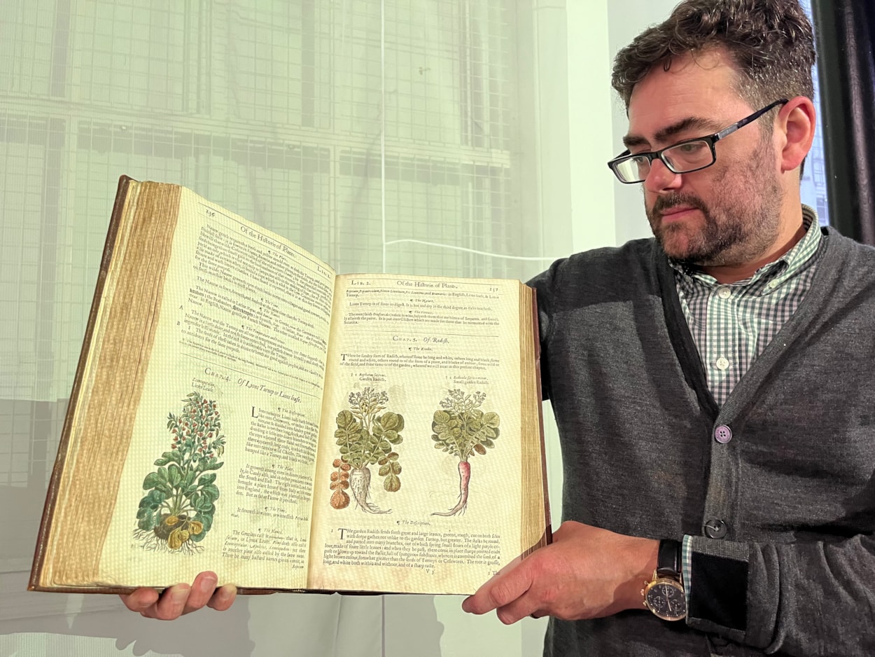 Unearthed at Leeds Central Library: On display as part of the free exhibition is a fascinating collection of beautifully illustrated manuals, compiled by some of history’s most esteemed horticulturalists.
Between their antique covers can be found centuries of accumulated wisdom about the best ways to grow fabulous fruit and vibrant veg as well as colourful flowers and fragrant herb patches.
Among the treasured tomes on display, pictured here with Antony Ramm, is a copy of The Herball or Generall Historie of Plantes, written by famed Elizabethan herbalist John Gerard.