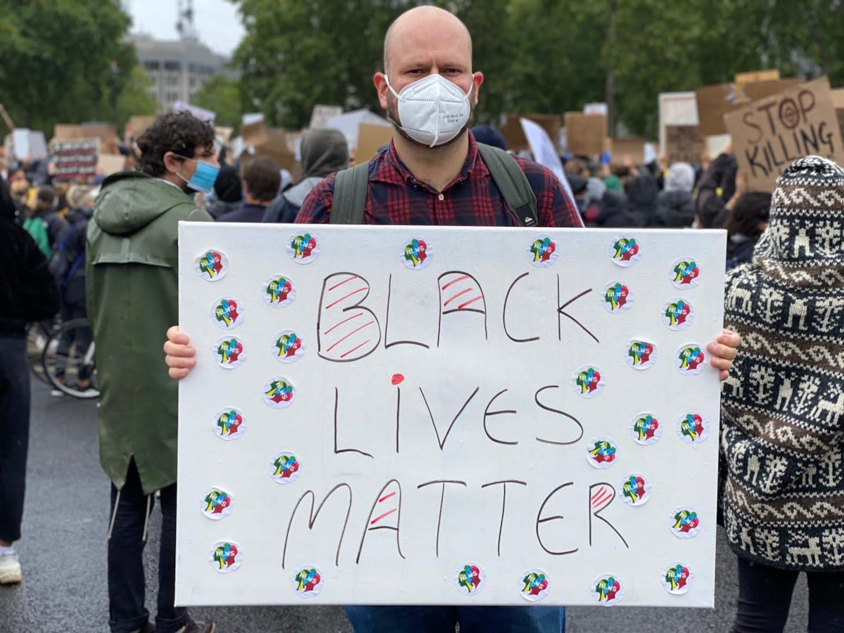Mayor Philip Glanville with Black Lives Matter poster