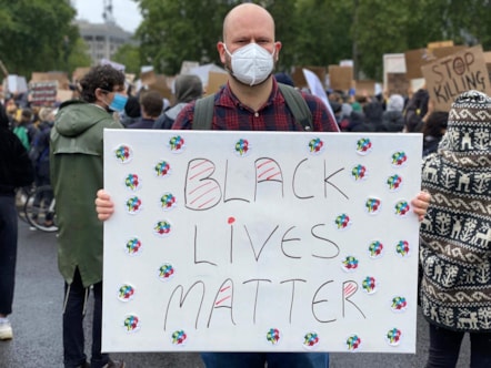 Mayor Philip Glanville with Black Lives Matter poster