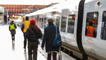 Image shows two customers boarding a Northern train