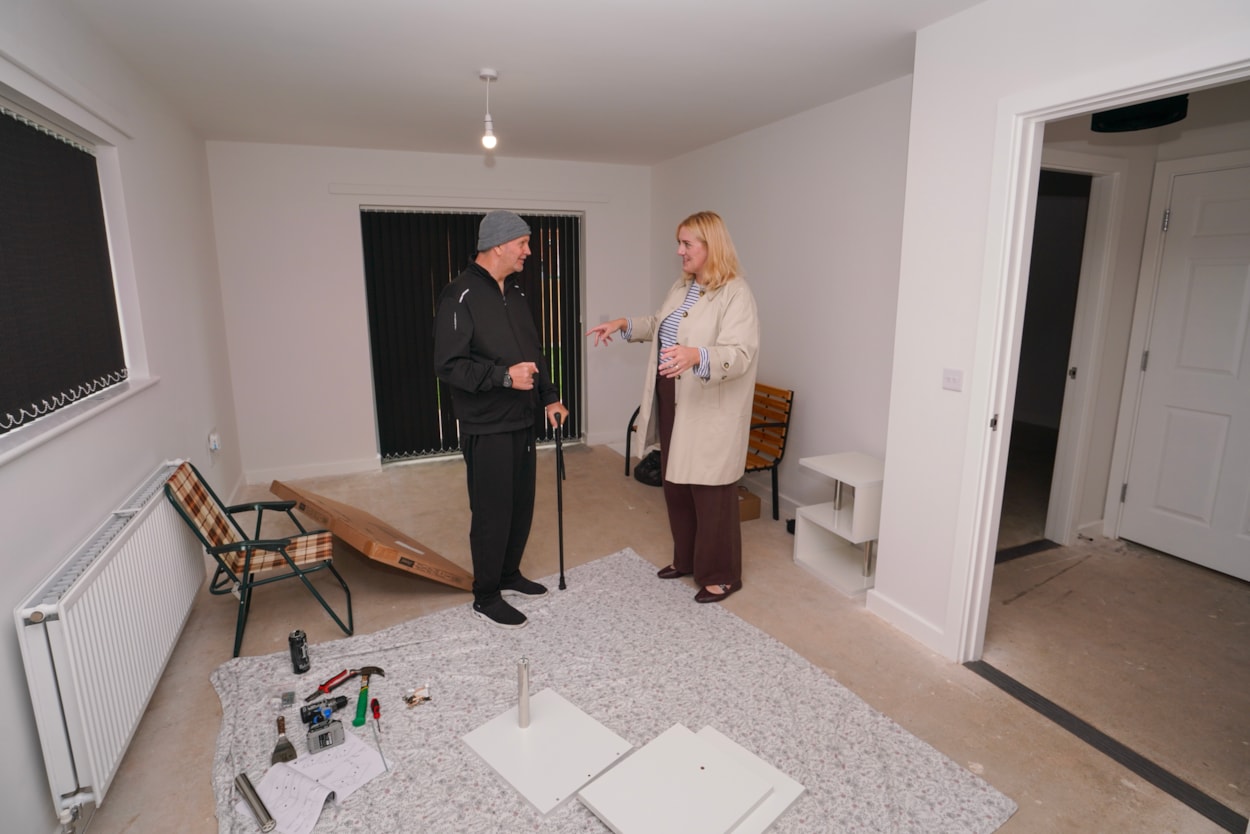 Ambertons 4: Councillor Jess Lennox, Leeds City Council’s executive member for housing, with tenant Paul Bennett at his new home, where the furniture is currently taking shape.
