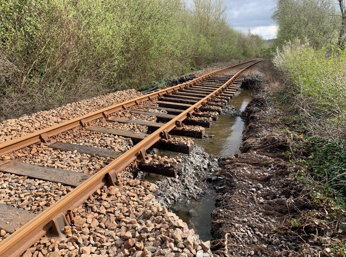 Picture from near Dolgarrog station on the Conwy Valley Line after river flooding washed away ballast on 9 April 2024-2