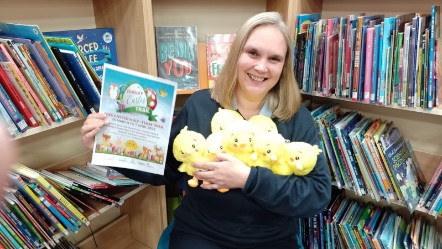 Stephanie Rhoden GLL libraries partnership manager with Easter chicks