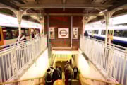 TfL Image - Weaver line roundel above the stairway at Hackney Downs station: TfL Image - Weaver line roundel above the stairway at Hackney Downs station