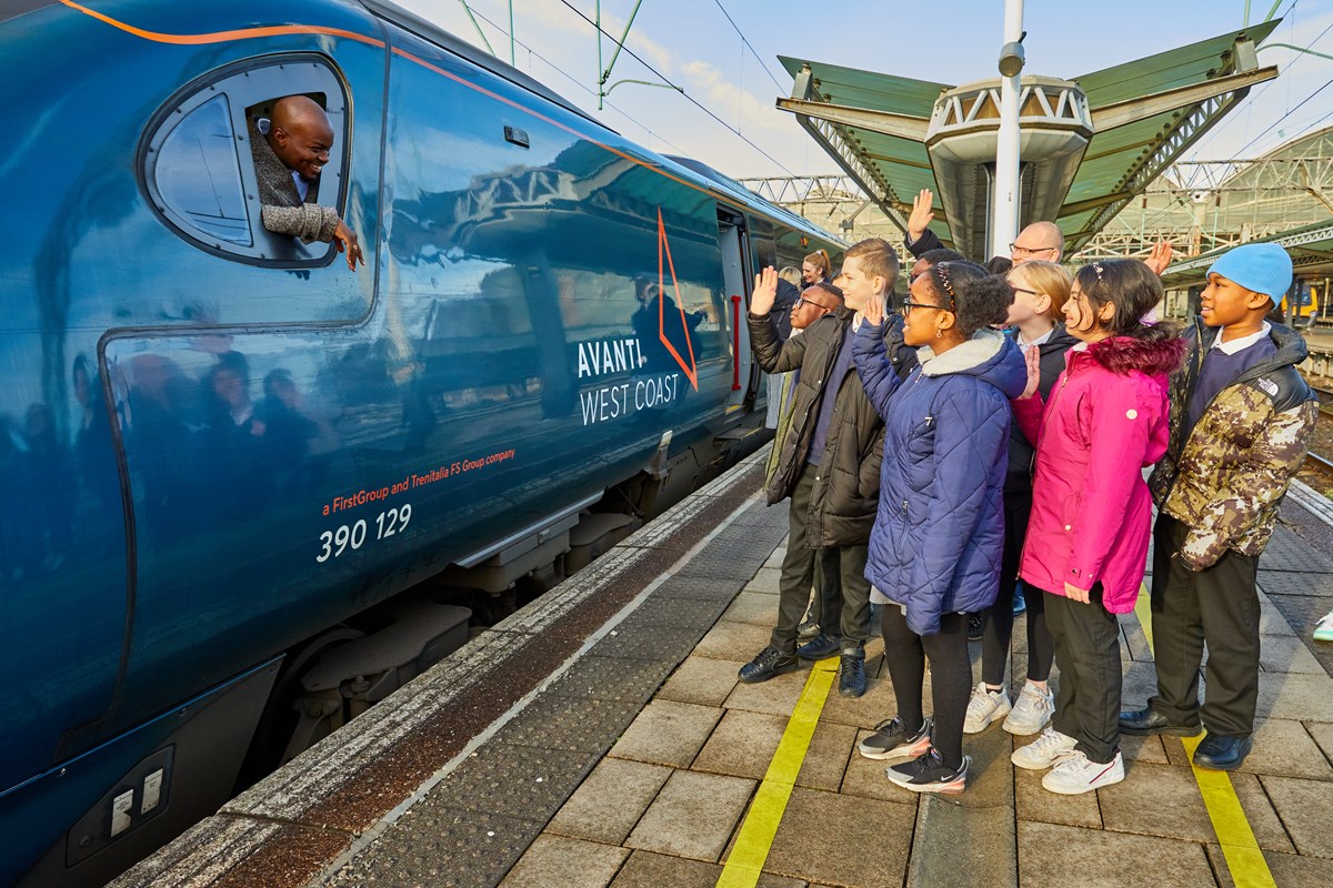 George The Poet at Manchester Piccadilly with pupils from Ashbury Meadow School on the way to London.