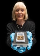 Finds specialist Lyn Blackmore with central pendant © MOLA (Andy Chopping)