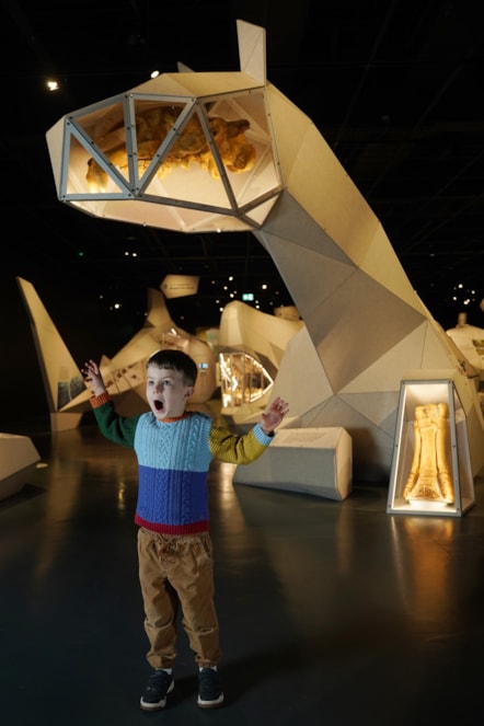 Arlo Cook (5) meets a prehistoric rhino at the National Museum of Scotland’s exhibition Giants. Photo © Stewart Attwood