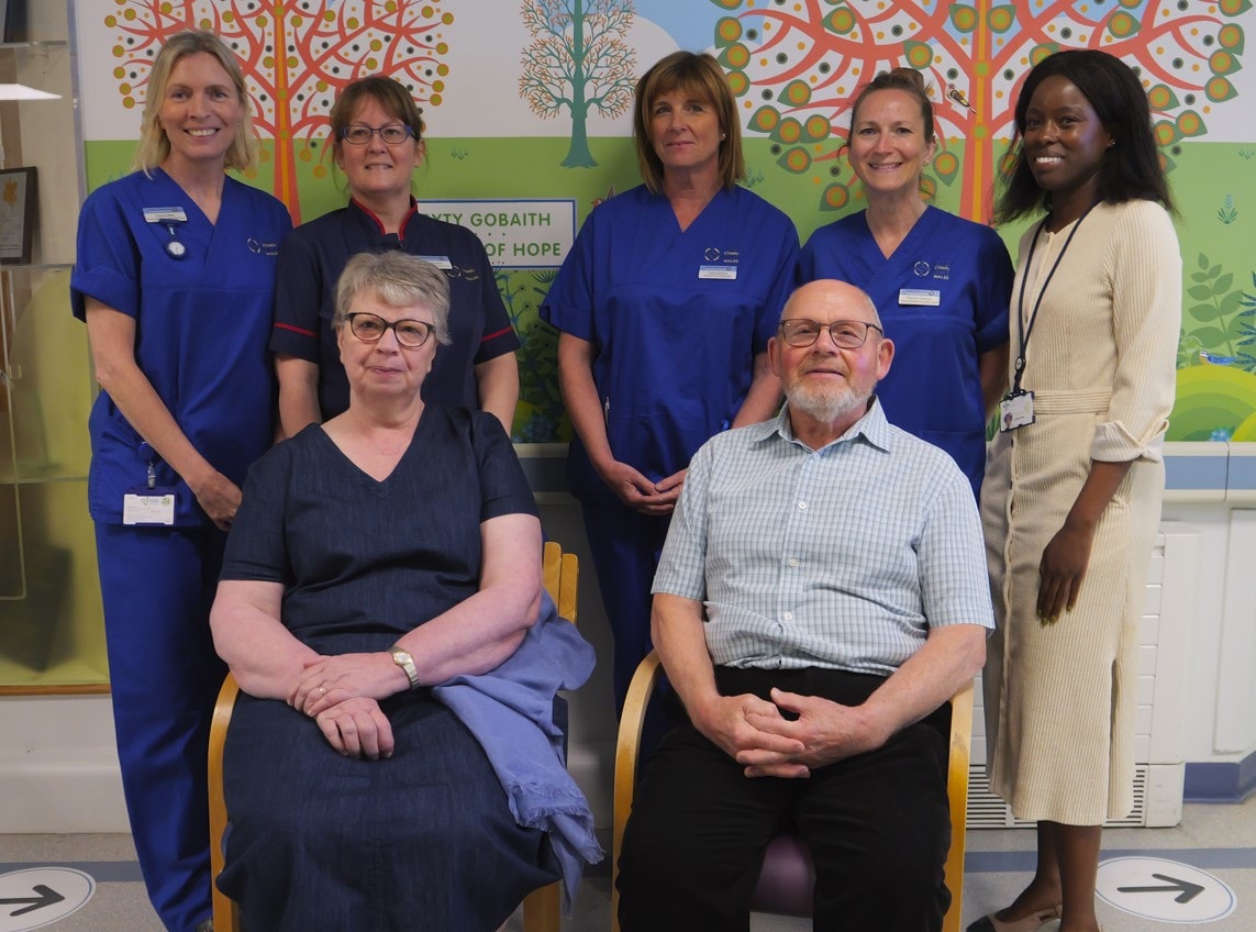 Patient Sharon Bettinson, from Caerphilly, with her husband and staff at Velindre Cancer Centre