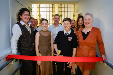 Adam and Alice officially open the exhibition by cutting a ribbon.  They are joined by the team who created the exhibition.