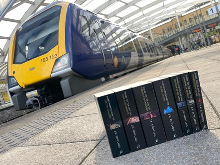 Image shows Harry Potter books alongside Northern train