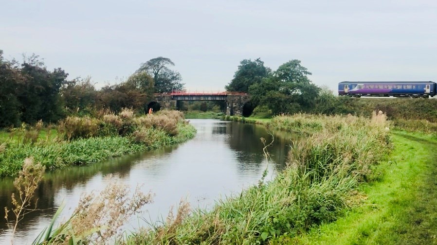Northern train about to cross old bridge in Burscough October 2019