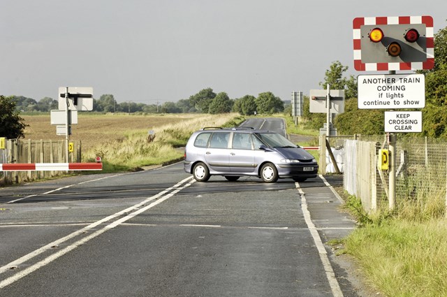 Top Gear - the car: A car sits on a level crossing