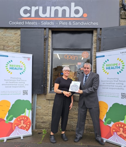 Donna Miller accepts Crumb's Award from Jamal Dermott, Recipe 4 Health lead at Lancashire County Council