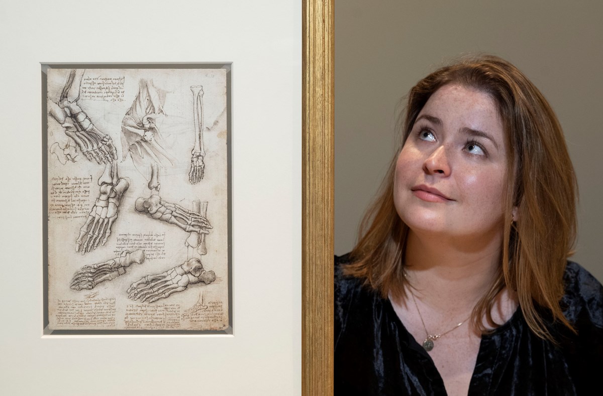 Curator Sophie Goggins with an anatomical study by Leonardo da Vinci. Royal Collection Trust © Her Majesty Queen Elizabeth II 2022.  Photo © Neil Hanna
