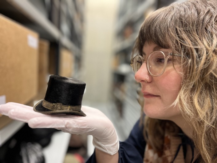 Leeds Discovery centre hats: Leeds Museums and Galleries' audience development officer Sara Merritt holds a tiny top hat, one of a remarkable range of tiny replica hats, some of which fit in the palm of a hand. They were made by Leeds hatter John Craig in the early 1900s and is being carefully conserved as part of a project at the Leeds Discovery Centre.