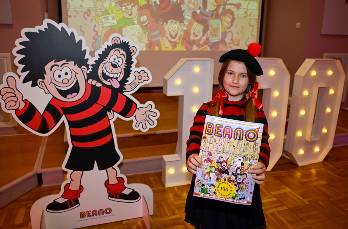 One of the first visitors to the National Library of Scotland's 100th birthday celebrations (7 August) where the Library was giving away special centenary editions of Beano. Credit: Neil Hanna