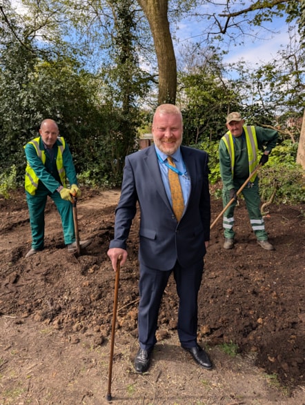 Cllr Damian Corfield with green care operatives laying compost at Coronation Gardens in Sedgley