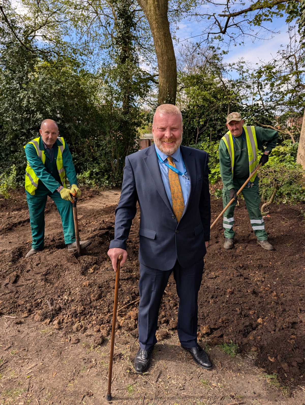 Cllr Damian Corfield with green care operatives laying compost at Coronation Gardens in Sedgley