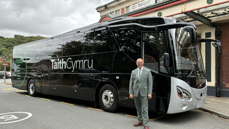 Deputy Minister for Transport Mark Hooper with a new TaithCymru coach in Bangor-2