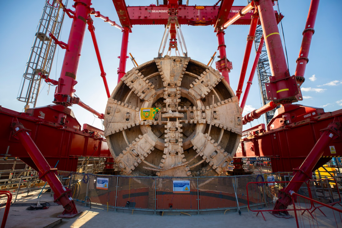 TBM Sushila removed after completing 5-mile journey to construct HS2's Northolt Tunnel under the capital-4: Following its 5-mile drive underneath the capital, HS2 lifted Tunnel Boring Machine (TBM) ‘Sushila’ out of the ground at the Green Park Way site in Greenford, West London.
 
The cutterhead, front and middle shield, weighting 880 tonnes, were lifted from the vent shaft in one piece on Saturday, March 15, using a 750 tonne gantry crane. The TBM – with a cutterhead spanning 9.48 metres in diameter – was launched from West Ruislip in October 2022 and completed its journey in December 2024. TBM Sushila excavated over 1.2 million tonnes of earth and installed 4,217 tunnel rings.
 
TBM Sushila was used to construct part of the Northolt Tunnel – an 8.4-mile tunnel being built by four TBMs which will take HS2 trains from Old Oak Common Station to the outskirts of the capital.

Copyright - HS2 Ltd