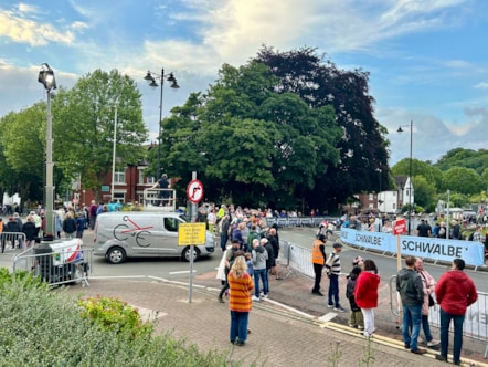 Spectators gather on Priory Road to watch the race