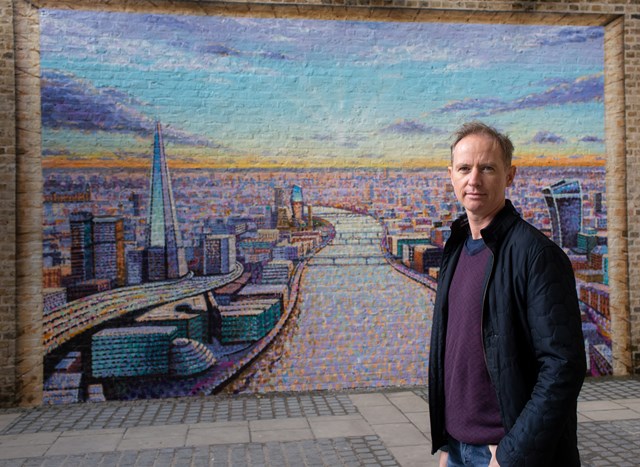 Artist Jimmy C with his work at Blackfriars