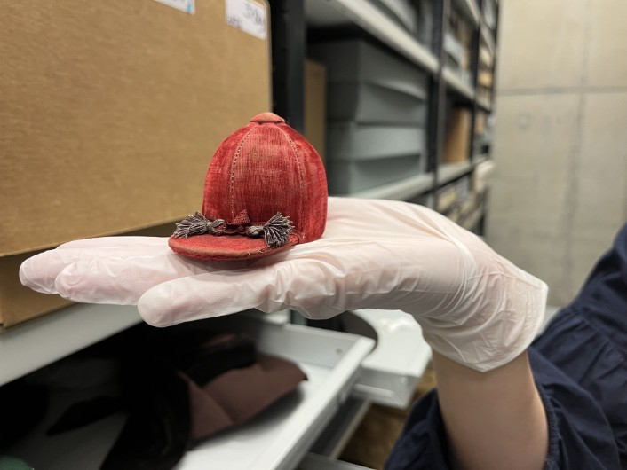 Leeds Discovery Centre hats: A miniature jockey's hat. The remarkable range of tiny replica hats, some of which fit in the palm of a hand, were made by Leeds hatter John Craig in the early 1900s and is being carefully conserved as part of a project at the Leeds Discovery Centre.