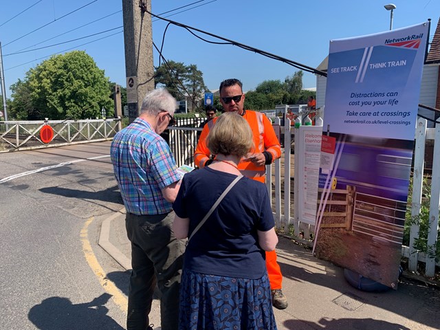 Level crossing manager Andrew Waling talks to members of the public about level crossing safety: Level crossing manager Andrew Waling talks to members of the public about level crossing safety
