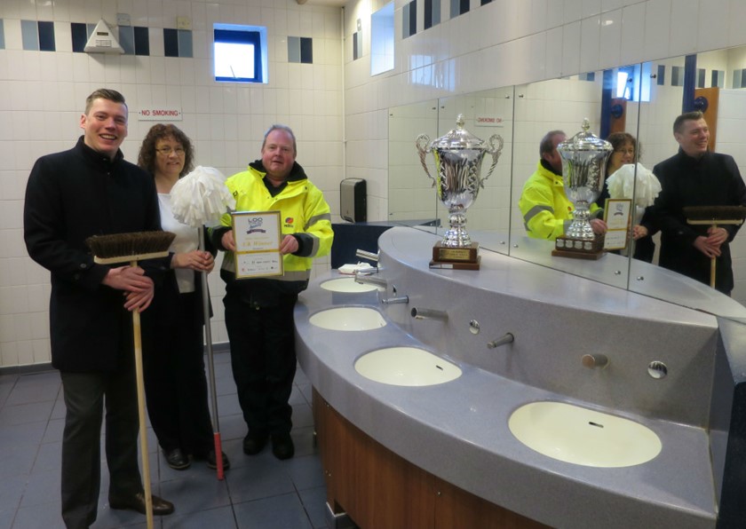 Ross Totney, Councillor Emma Stokes and Eric Johnson with the trophy inside the award-winning toilet at St Andrew’s Precinct in Droitwich.