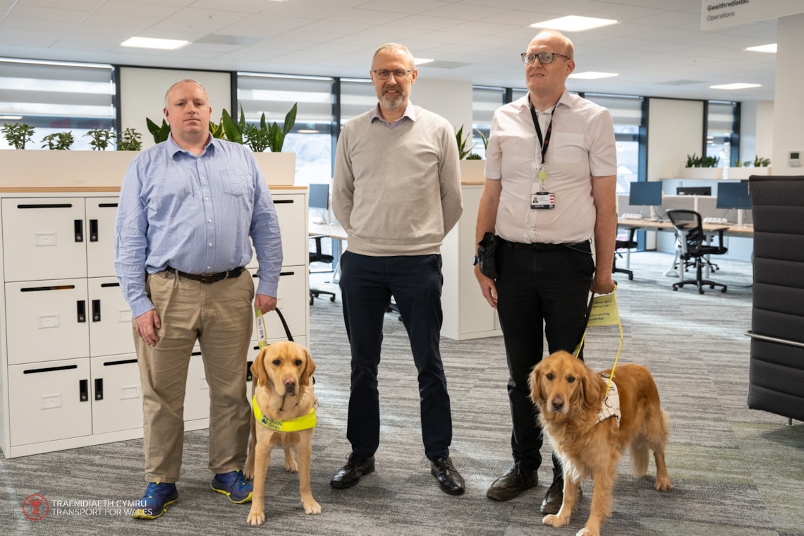 Nathan Foy, Guide Dogs Cymru and Joey the Guide Dog, Geoff Ogden TfW and Ryan Moreland and Guide Dog Jamie