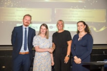 Siemens Mobility workplace programme: Intern Lucy Yardy is congratulated by, from left, Craig Beech, Service Operations Manager at Siemens Mobility’s Goole Rail Village; Gemma Sampson, Supported Internship Lecturer at Selby College; and Ruth Konieczna, Employability Support Coach at Hft.