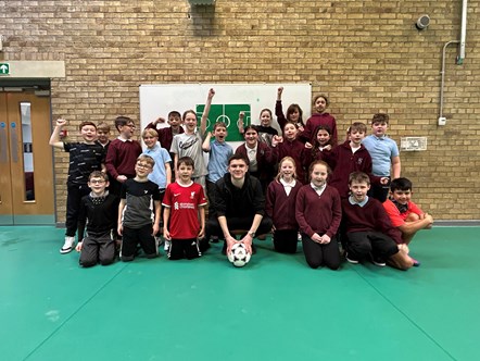 Buckie Thistle midfielder Marcus Goodall in group pic with Buckie's P6 Millbank Primary pupils.