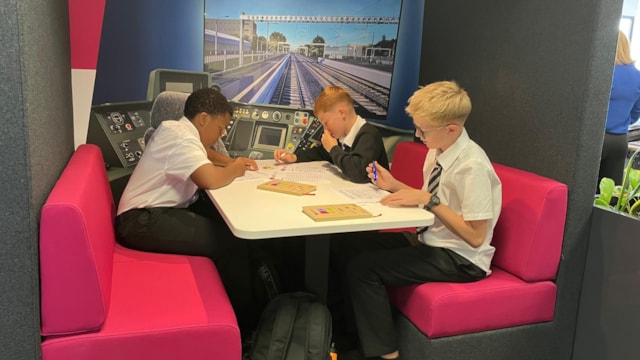 Pupils completing puzzles at safety event: Pupils completing puzzles at safety event