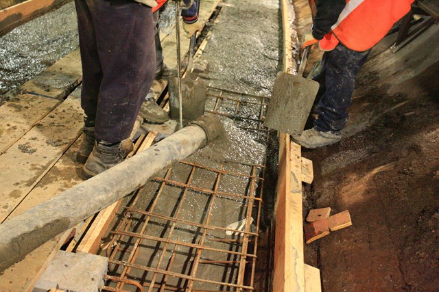 Pouring the concrete into the shuttering: Pouring the concrete into the shuttering