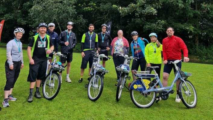 Leeds City Council's safe and sustainable travel team with Dawn Barrett's sister: Members of the safe and sustainable travel team with Leeds City Bikes