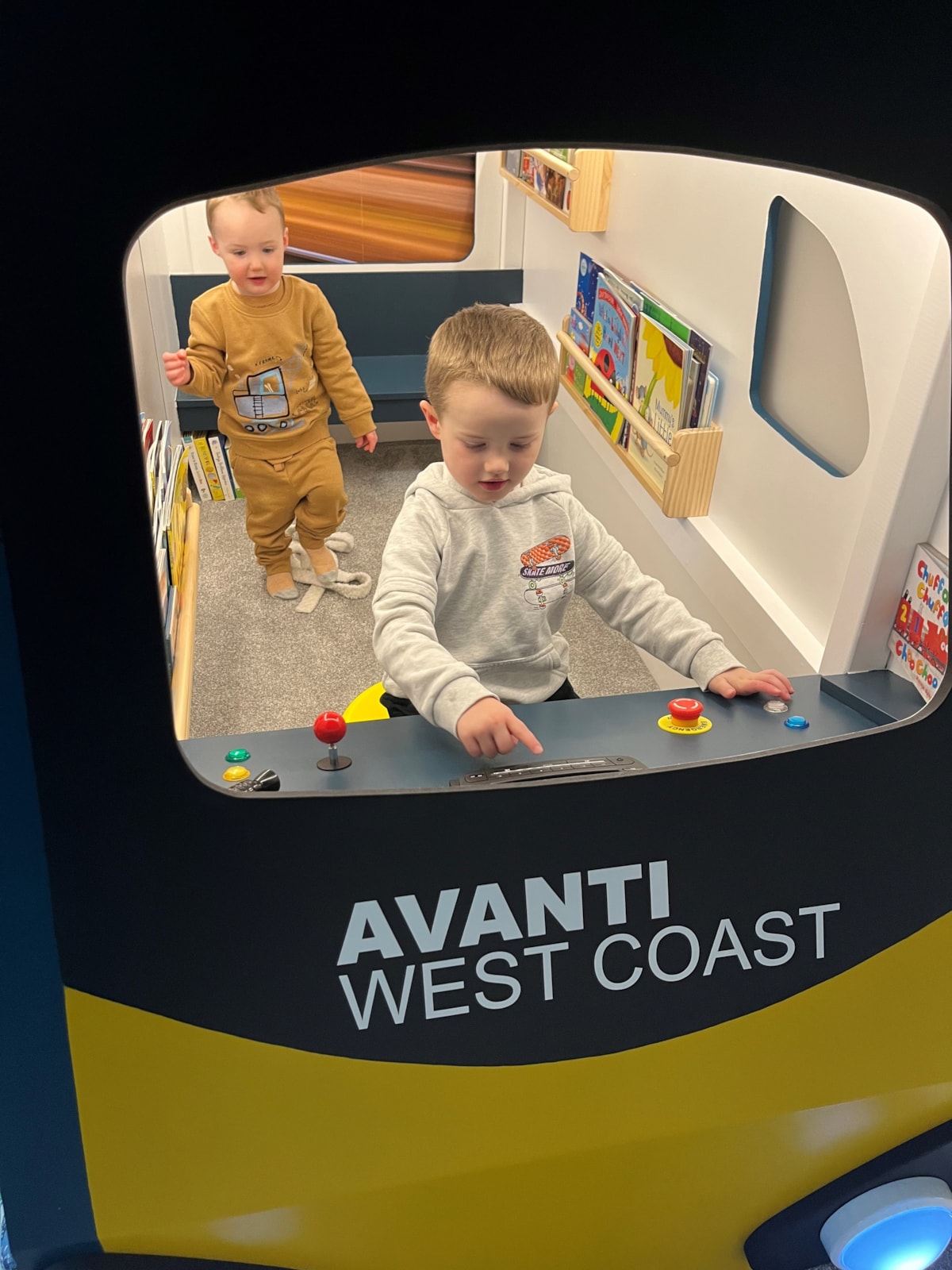 Daniel Rogerson plays with his brother in his Avanti West Coast Pendolino bed that was created by Octavia Chic.