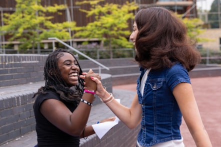 Neveah, left, and Jasmine celebrate their GCSE results at City of London Academy Highbury Grove