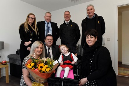 Cllrs Douglas Reid, Elena Whitham, Drew Filson, with Melissa and Sofia, and reps from Housing and CCG: Melissa and Sofia moved into a new build home in Dalrymple, which has transformed their lives.