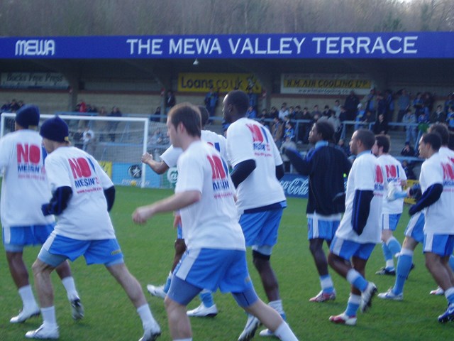 Wycombe Wanderers Players No messin'! warm up 1 Jan 07: Players warm up with special No messin'! T Shirst to help get across the rail safety message